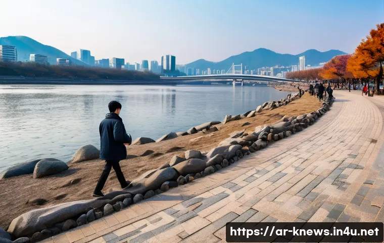 한강 대학생 실종 사건 - A serene riverside scene along the Han River in Seoul during a cold, breezy late afternoon with slip...